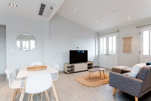 Deluxe Apartment | Living area | 55-inch Smart TV with digital channels, TV