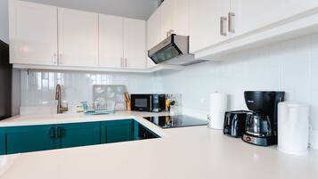 Deluxe Apartment | Private kitchen | Full-size fridge, dishwasher, coffee/tea maker, electric kettle
