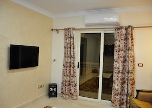 Comfort Apartment, 3 Bedrooms, Garden View | Living area | LCD TV