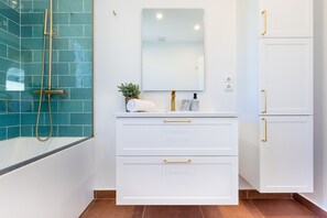 Bathtub, hair dryer, towels