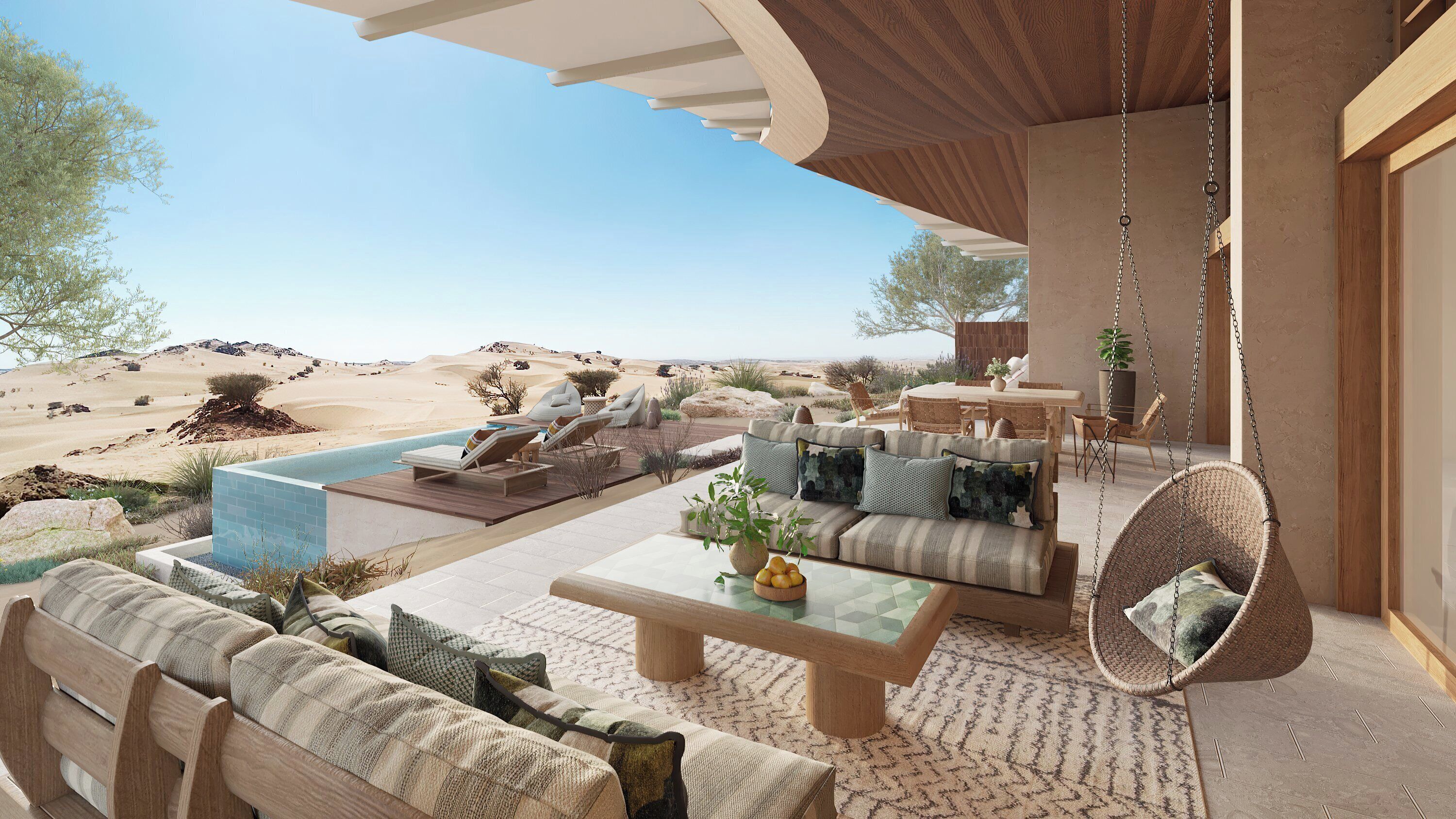 Un espacio exterior moderno con piscina, mobiliario y vistas al desierto.