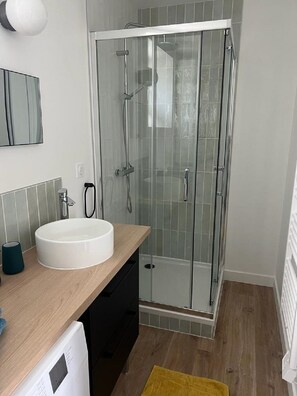 Shower, hair dryer, towels, soap