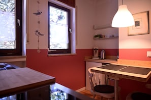 Fridge, stovetop, dishwasher, coffee/tea maker
