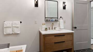 Bathtub, hair dryer, towels