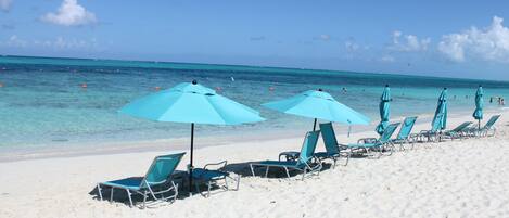 On the beach, sun loungers, beach towels