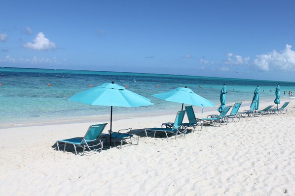 On the beach, sun loungers, beach towels