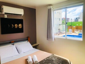 Family Apartment, 2 Bedrooms, Pool View, Beachside | Desk, laptop workspace, free WiFi - Liara Apartamento (Picarras)