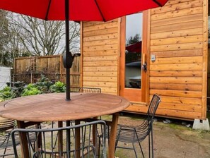 Outdoor dining - 2Bd Bungalow with backyard sauna, by Alberta Arts (Portland)