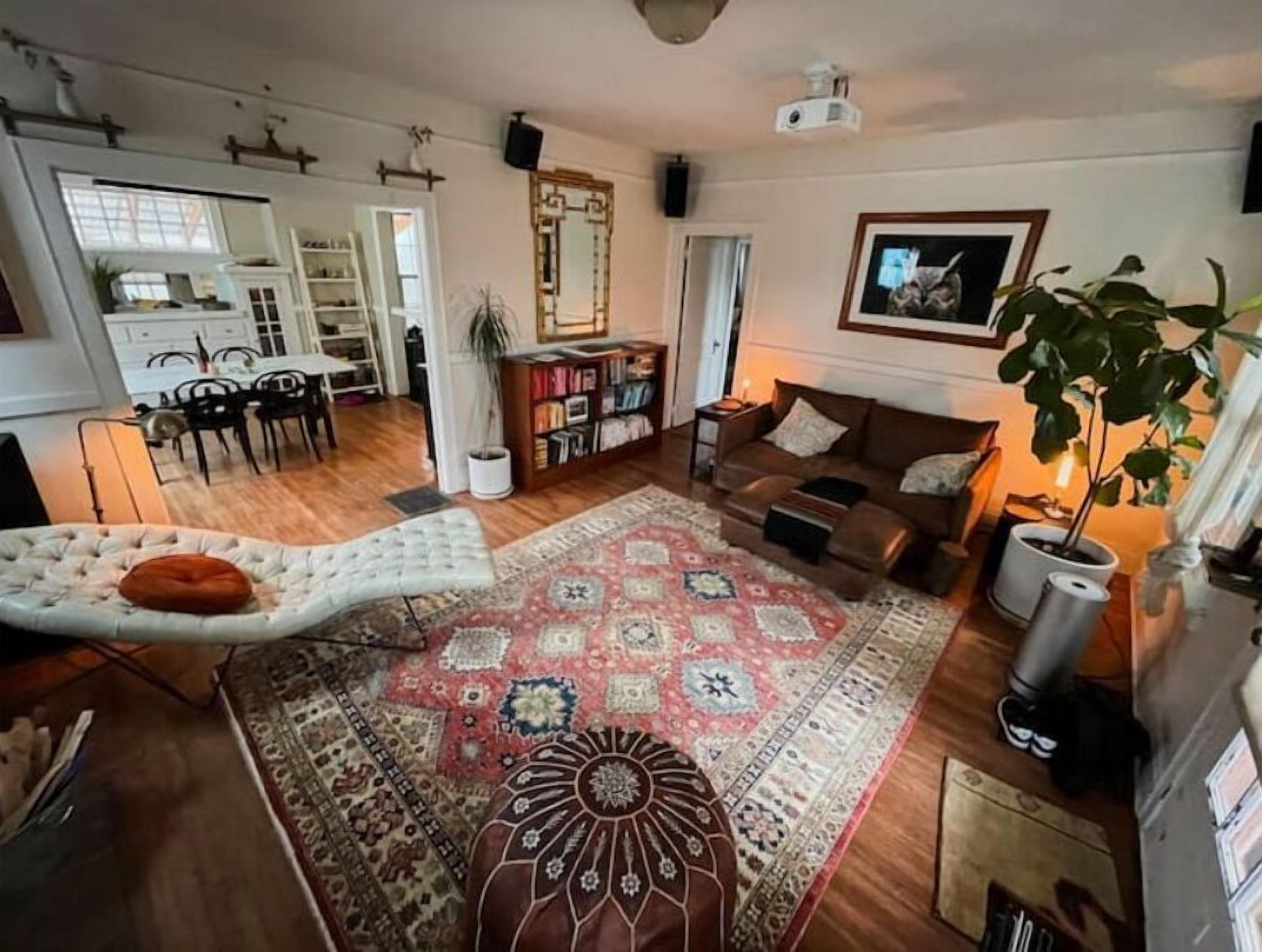 Smart TV, fireplace, books, computer monitors