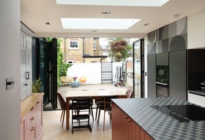 Enjoy meals al fresco on the patio, then cook up a storm in the spacious kitchen with a large island and stovetop.