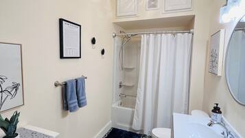 Shower, hair dryer, towels, soap