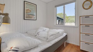 A bedroom with a bed, a framed picture of Denmark, a window, and a wardrobe. - Beautiful home in Haderslev with WiFi (Haderslev)