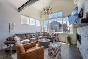 TV, fireplace, table football, stereo - Flat Tops Haven | Prime Location | Pool & Multiple Hot Tubs | Close To Resort (Steamboat Springs)