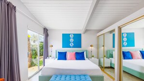 A modern bedroom with a large bed, two bedside tables, a bench, and a sliding glass door to a balcony. - 25% Off Sept 10-12 Great 4 Families -Pool, Jacuzzi (Palm Springs)