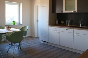 Dining - Vacation apartment Hof Margarethental - Renovated half of the house for 6 persons on a beautiful (Goldelund)