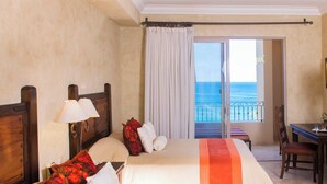 A hotel room with two beds, a balcony with a view of the sea, and a dining area. - Villa La Estancia Resort - Cabo San Lucas-2 bedroom Suite (Cabo San Lucas)
