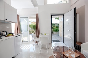 Enjoy meals in the well-equipped kitchen with a stainless steel range and dining area.