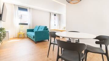 Design Loft | Living area | 58-inch Smart TV with cable channels, TV