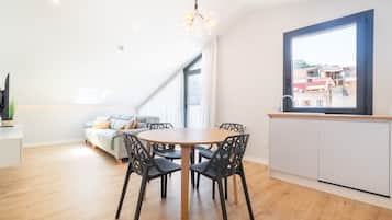Design Penthouse | Living area | 58-inch Smart TV with cable channels, TV