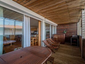 Enjoy a homey atmosphere in this stylish space with a dining area, kitchen, and cozy seating nook.