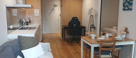 Deluxe Apartment | Living area | 42-inch LCD TV with cable channels, TV