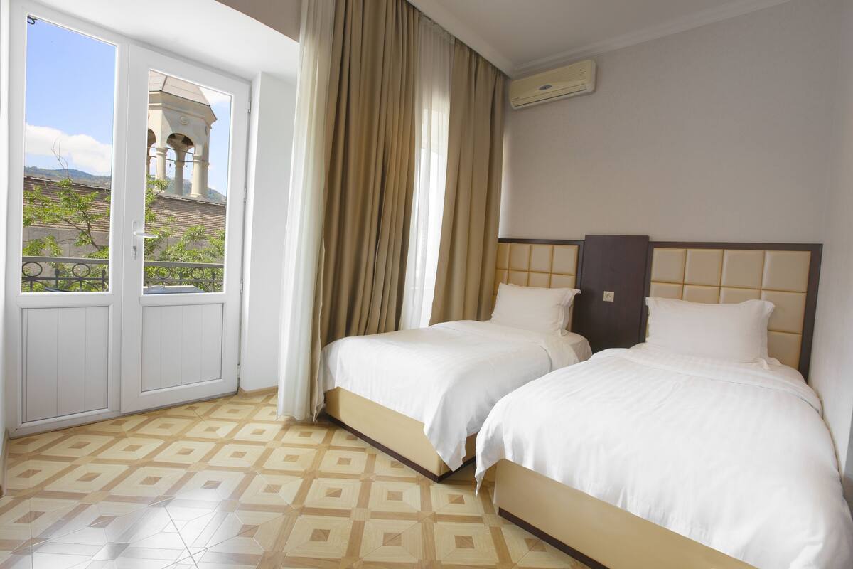 Standard Twin Room | In-room safe, desk, blackout drapes, iron/ironing board (on request)