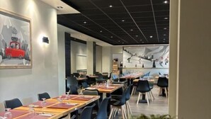 A conference room with long tables, chairs, and a ceiling with recessed lighting. - Chalet Sainte Anne (La Condamine-Chatelard)