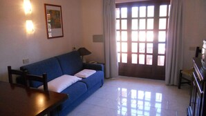Living area - Apt. Costa 1A with shared Swimming Pool (Arzachena)