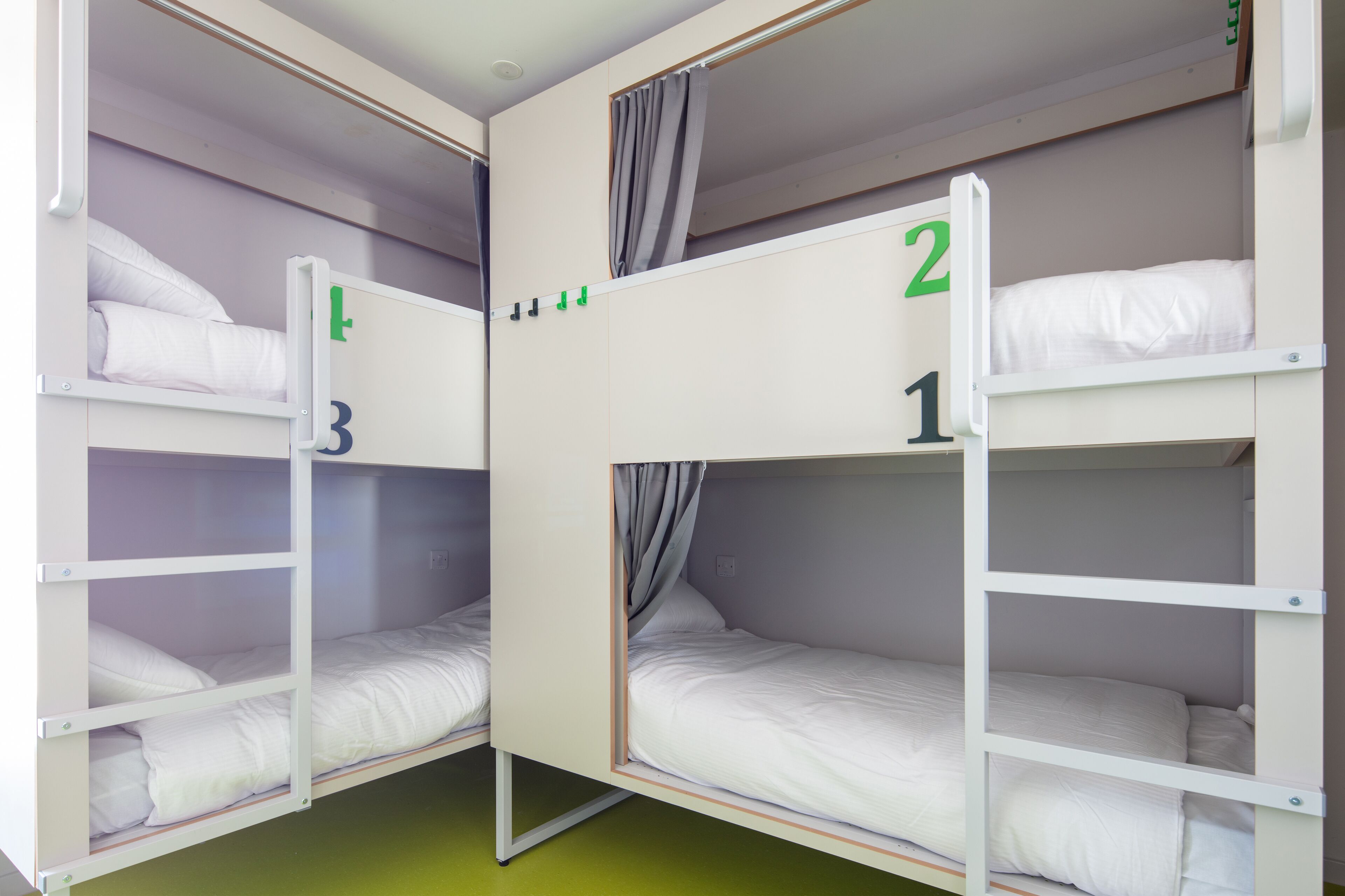 A room with bunk beds labeled 1, 2, and 3.