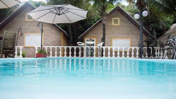 Outdoor pool, open 10:00 AM to 8:00 PM, pool umbrellas