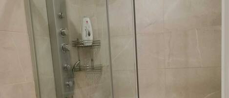 Shower, hair dryer, towels, soap