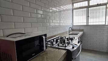 Apartment | Private kitchen | Full-sized fridge, microwave, oven, blender