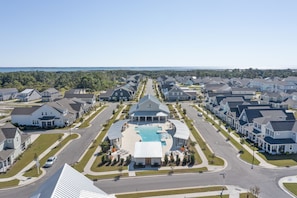 A residential area with a central swimming pool surrounded by houses.