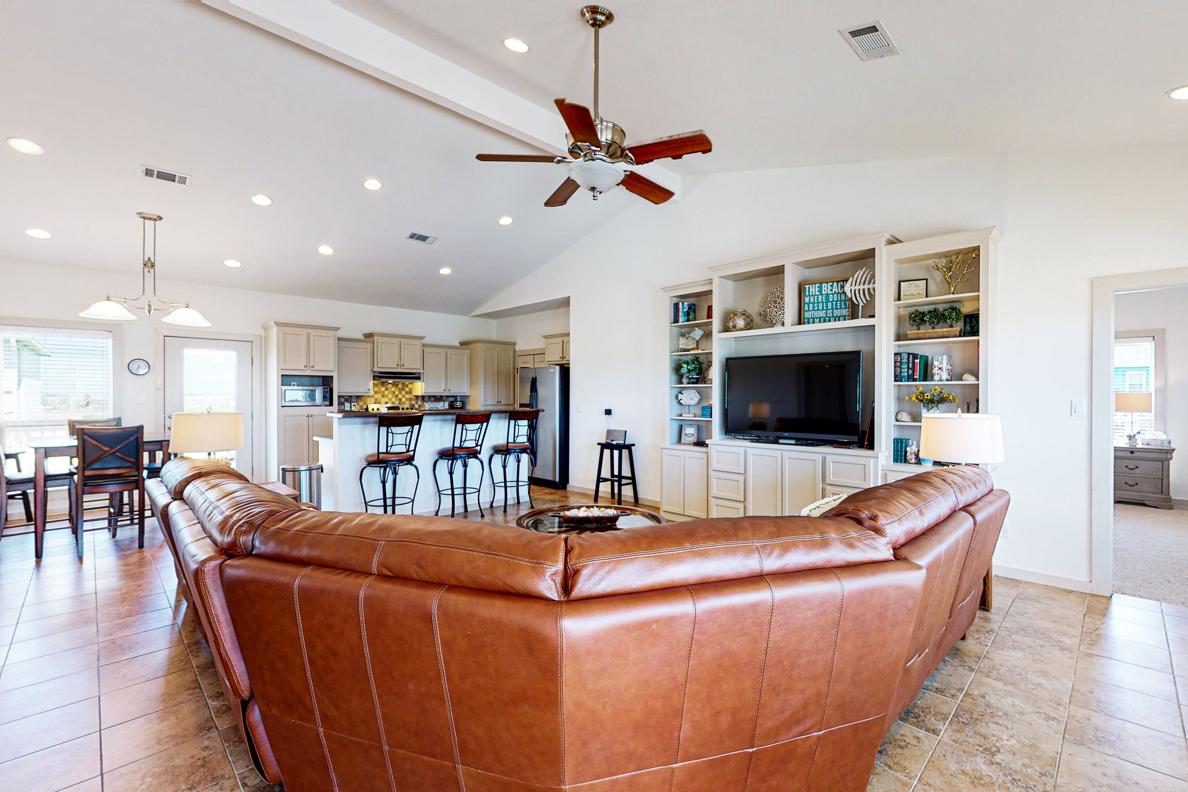 Inviting house with private hot tub, deck, fenced yard, W/D, & AC