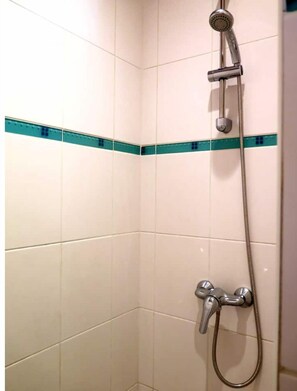 Shower, towels, soap, toilet paper