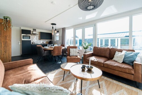 Ground floor House with terrace on south. Near woods and outdoor swimming pool.