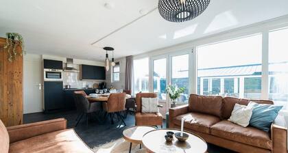 Ground floor House with terrace on south. Near woods and outdoor swimming pool.