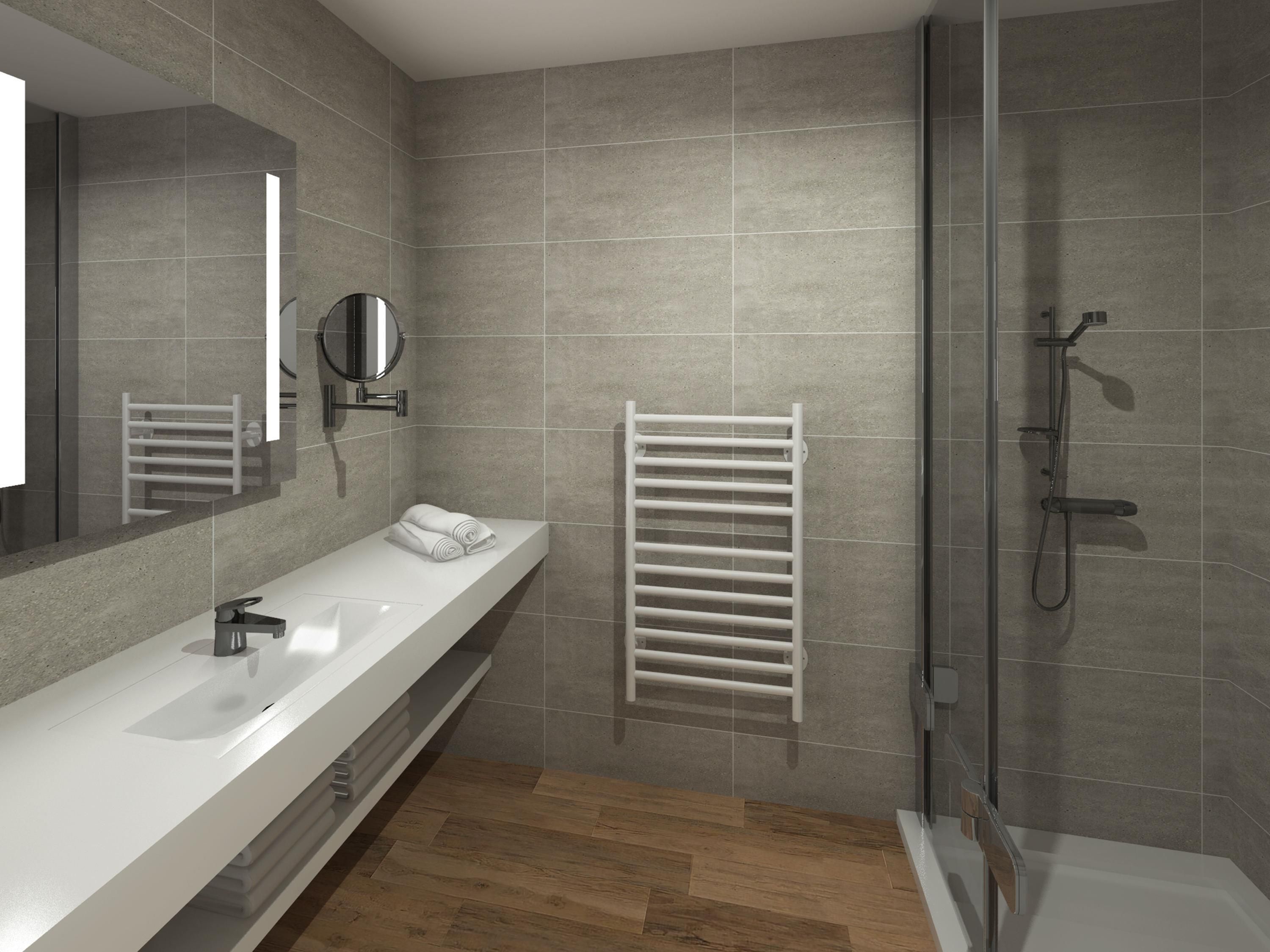 A modern bathroom with a large mirror, a white sink, a towel rack, and a shower area.
