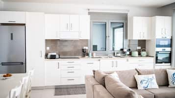 Deluxe Apartment | Living area | 40-inch Smart TV with cable channels, TV