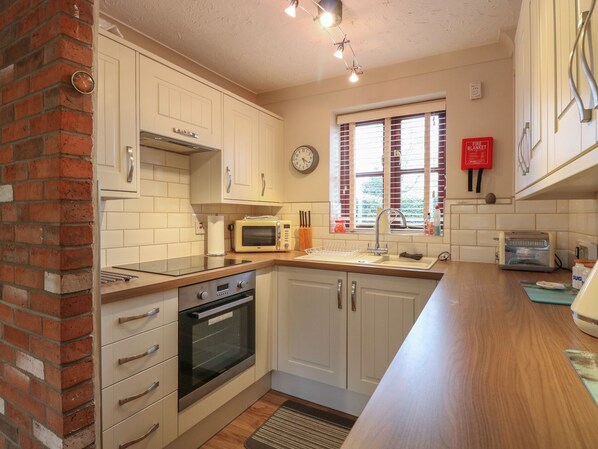 Fridge, electric kettle, toaster, cookware/dishes/utensils