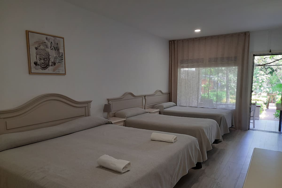 Family Quadruple Room, Garden View, Ground Floor | Free WiFi, bed sheets