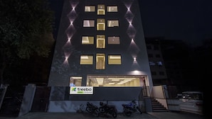 A modern building with a sign reading "treebo trend Pink City Grand". - Treebo Pink City Grand (Jaipur)