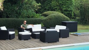 A poolside area with outdoor furniture, a pool, and a well-maintained garden. - Grand Cottage-Near Benodet-Heated Pool (Tréméoc)