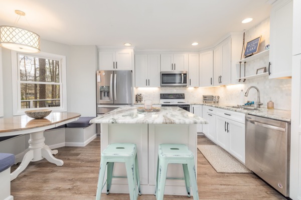 Fully stocked kitchen with ample counter space and updated appliances.