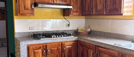 Fridge, microwave, stovetop, coffee/tea maker