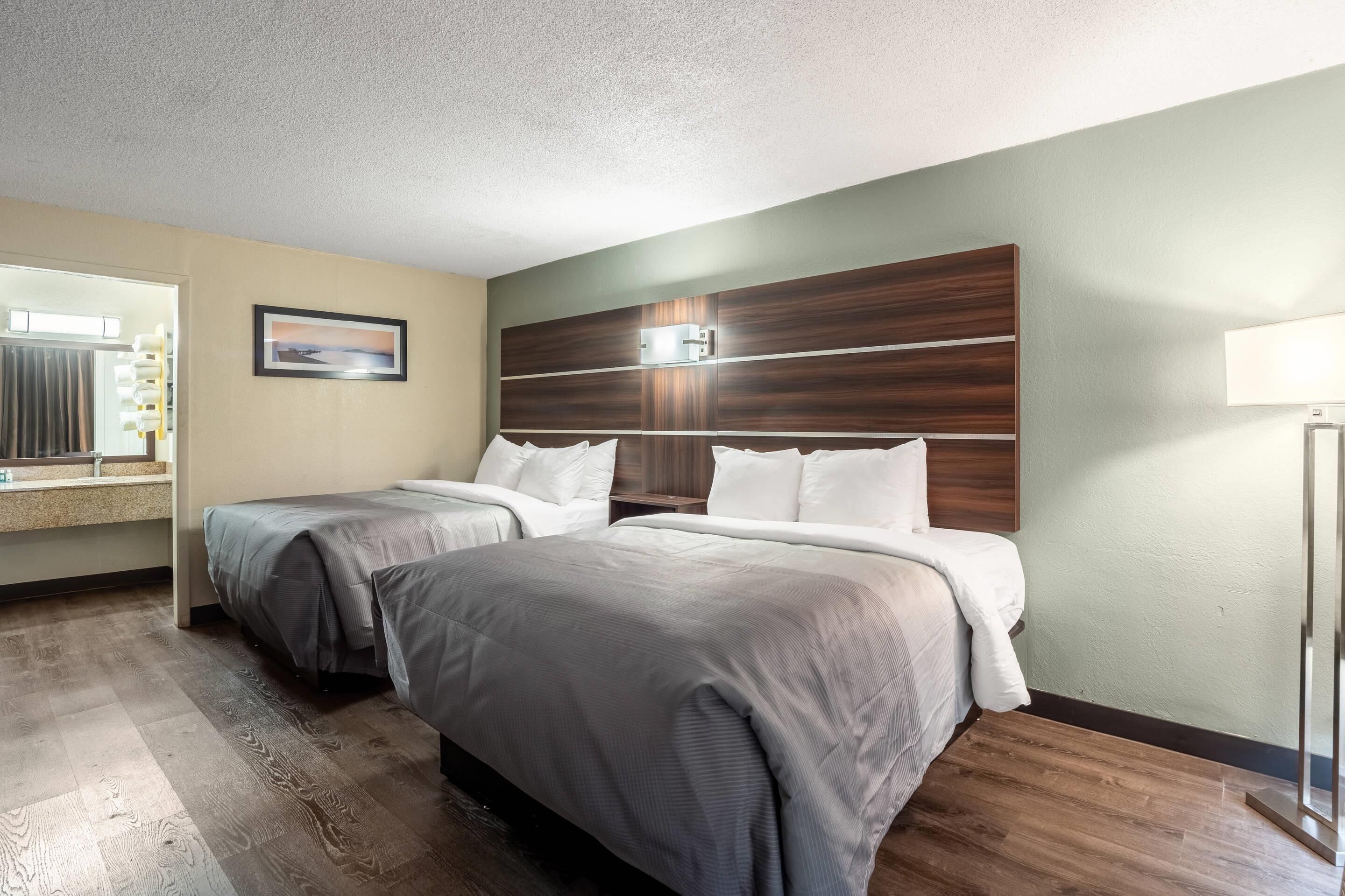 Premium bedding, memory-foam beds, desk, blackout curtains