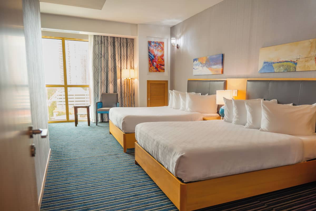 Deluxe Suite | Living area | 50-inch Smart TV with cable channels, TV