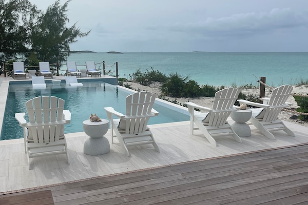 Deck with heated pool, sun ledge and loungers