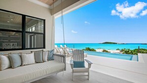 A beachside lounge with a sofa and chairs, a pool, and a view of the ocean. - CIESTA SANDS- Beachfront Luxury, Top Beach, 4 bedrooms w private bath, Pool (Moore Hill)