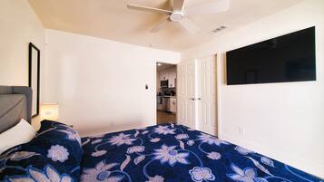 1 bedroom, desk, iron/ironing board, travel crib